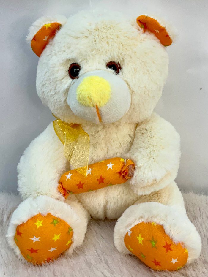 Peluche de osito con lazo dorado