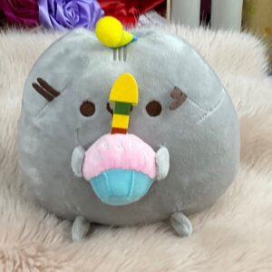 Peluche de gato con magdalena